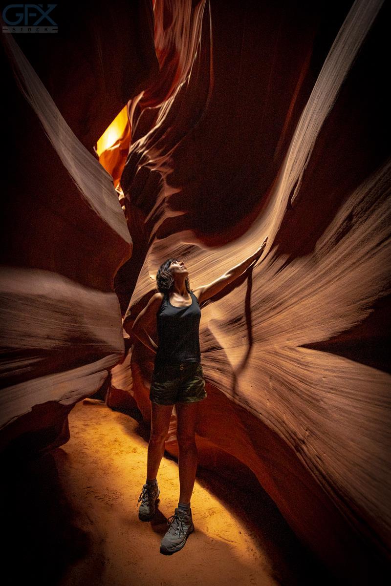 A young woman admiring the beauty of the Upper Antelope Canyon in the town of Page, Arizona